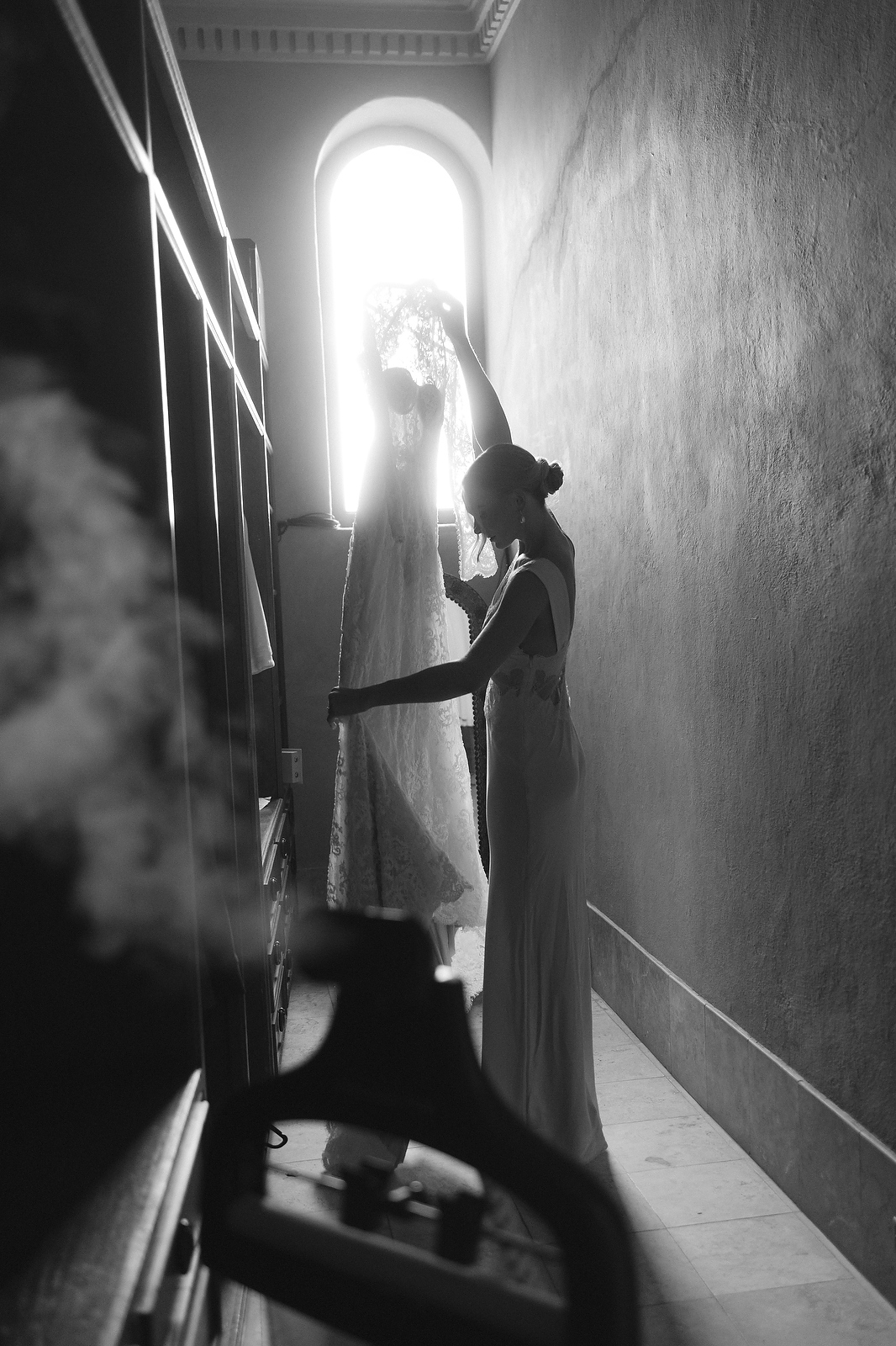 Bride with wedding dress silhouette by window in San Miguel de Allende