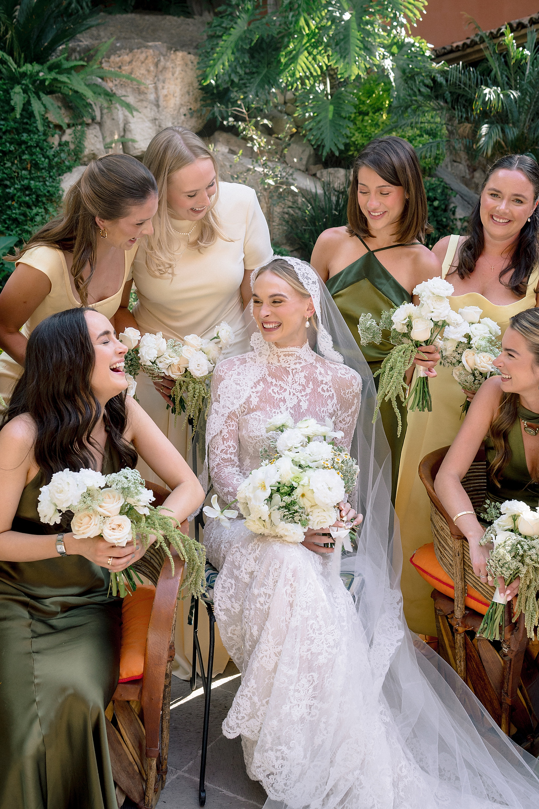 Bride laughing with bridesmaids in green dresses at San Miguel de Allende wedding