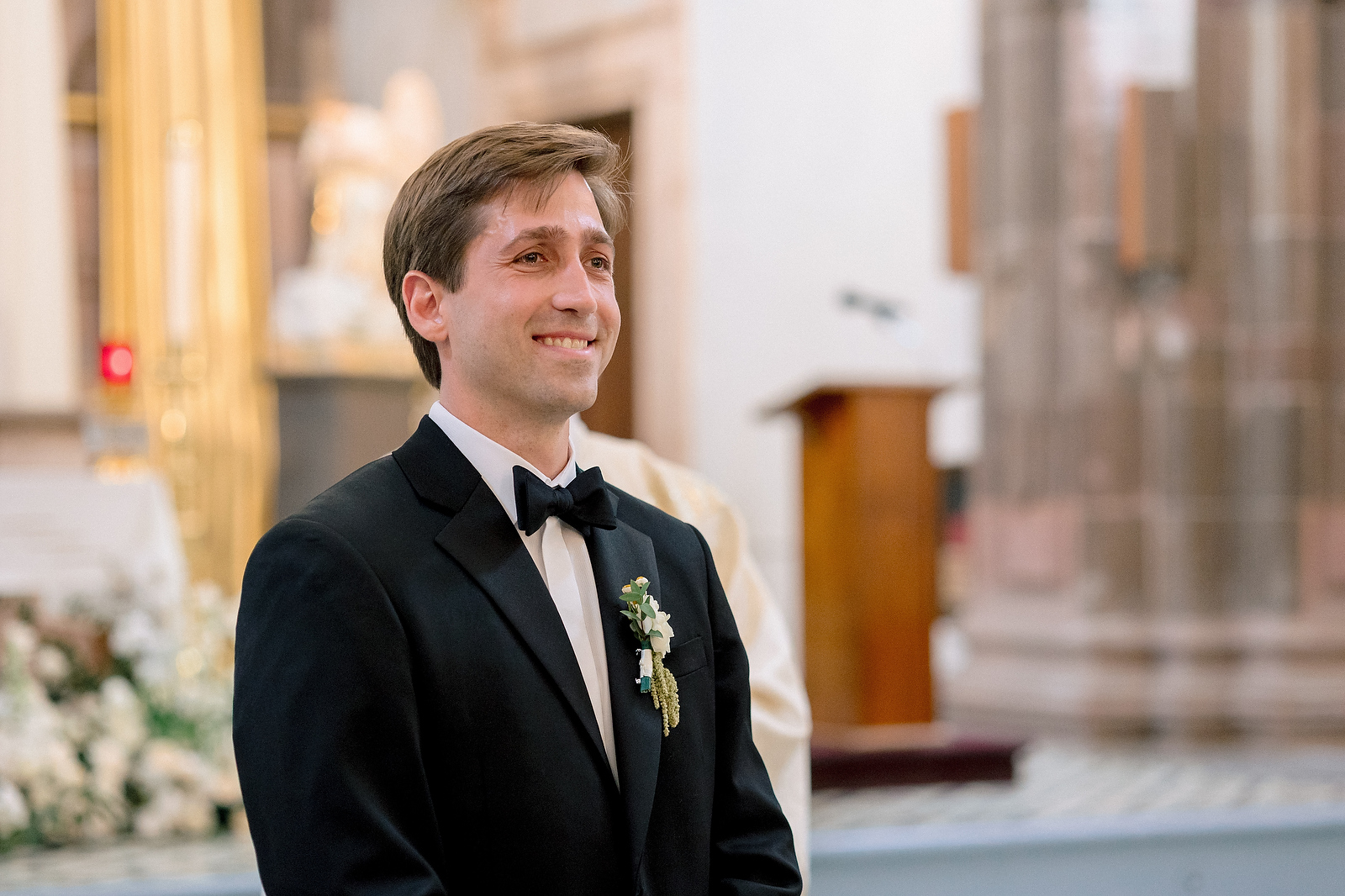 Groom watching bride walk down the aisle at San Miguel de Allende church