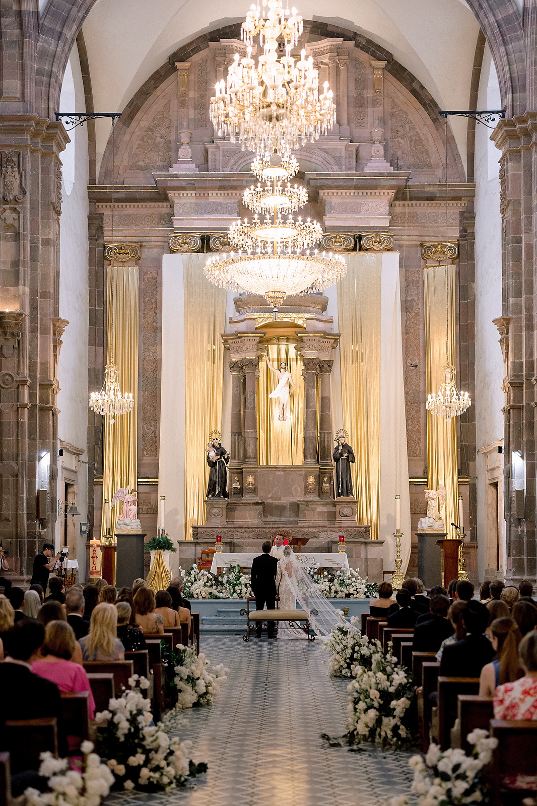 Grand cathedral ceremony at San Miguel de Allende with chandeliers and flowers  -  Marco Wang Photography