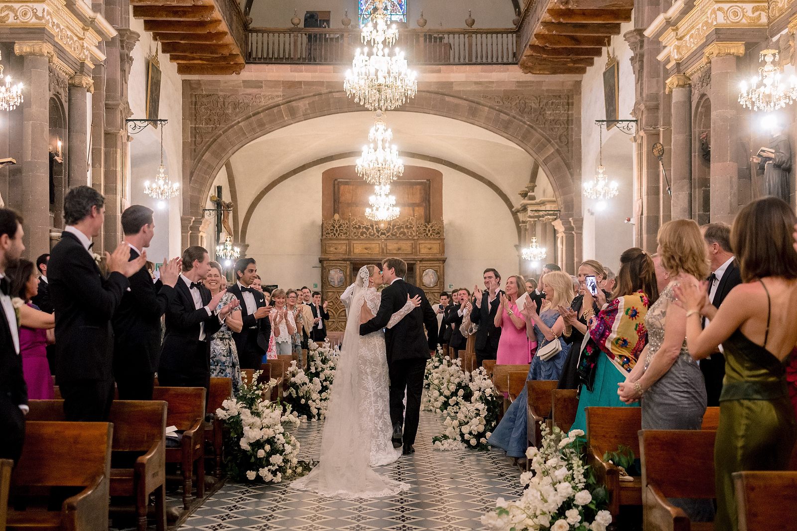Bride and groom recessional kiss at San Miguel de Allende church ceremony