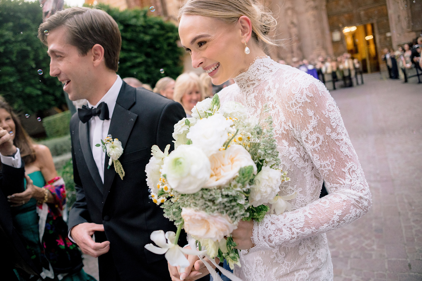 Bride with bouquet exiting church in San Miguel de Allende  -  Marco Wang Photography