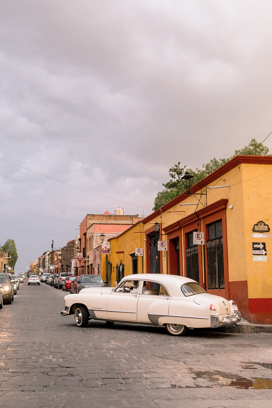 Vintage Cadillac on cobblestone streets of San Miguel de Allende