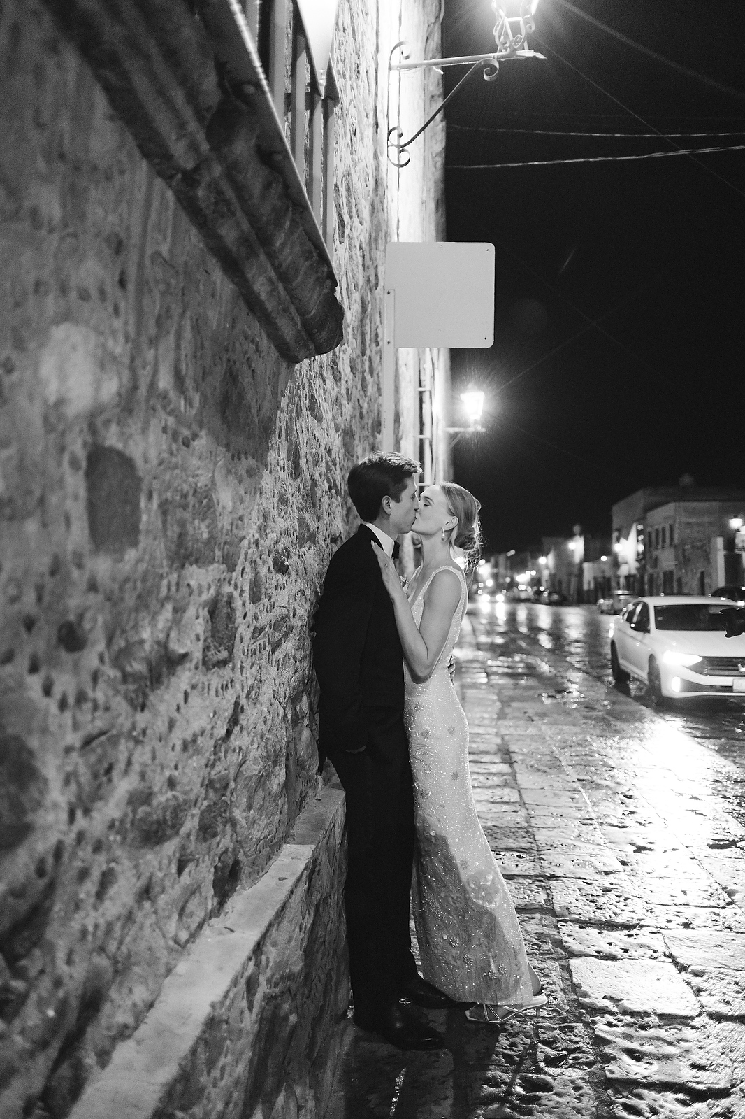 Chloe and Jett kissing on cobblestone street at night in San Miguel de Allende  -  Marco Wang Photography