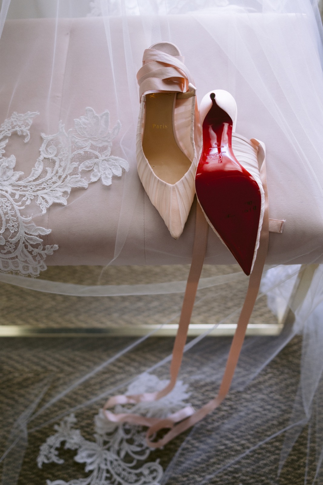 Luxury bridal shoes and lace veil wedding details