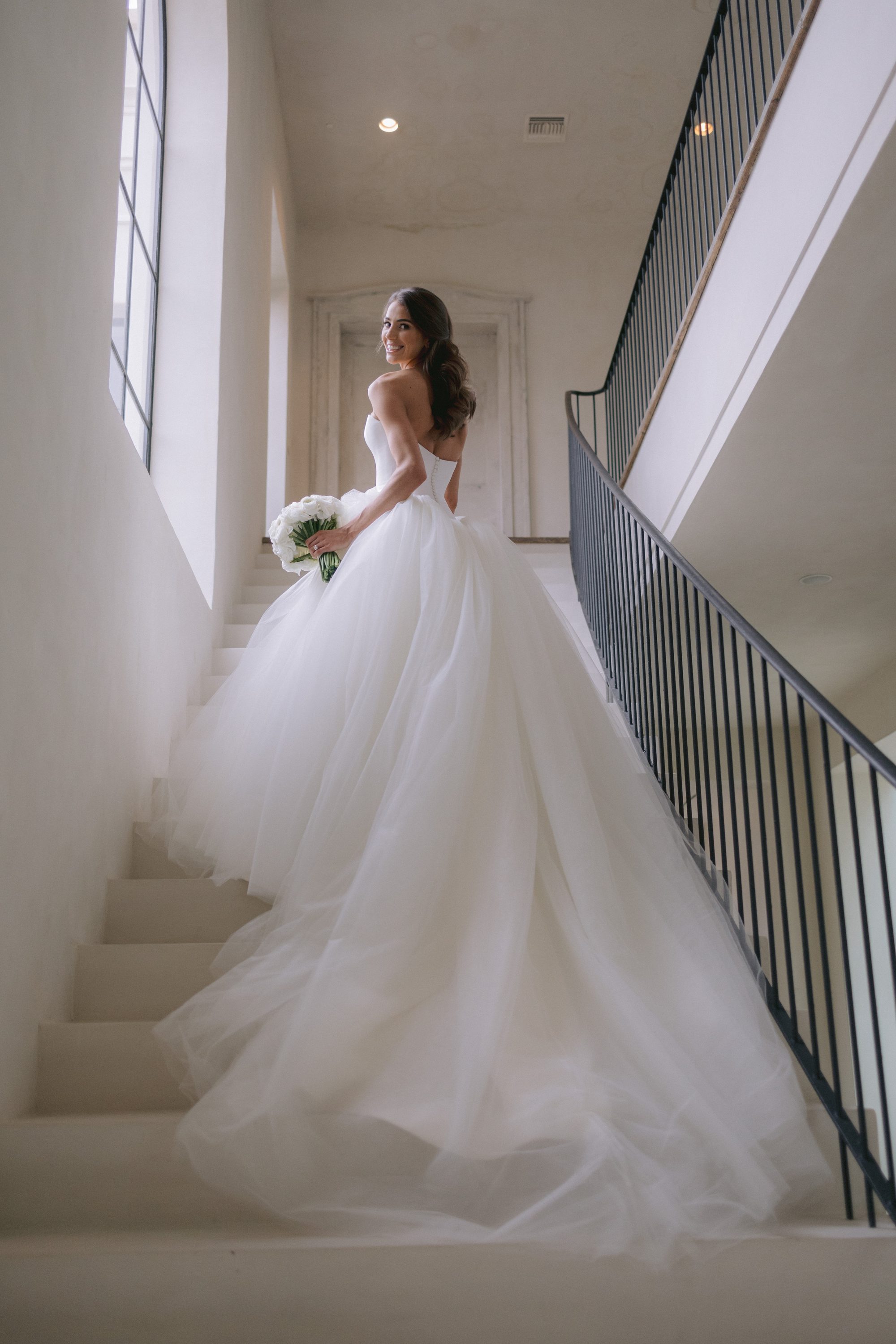Bride on staircase at The Houstonian Hotel Houston