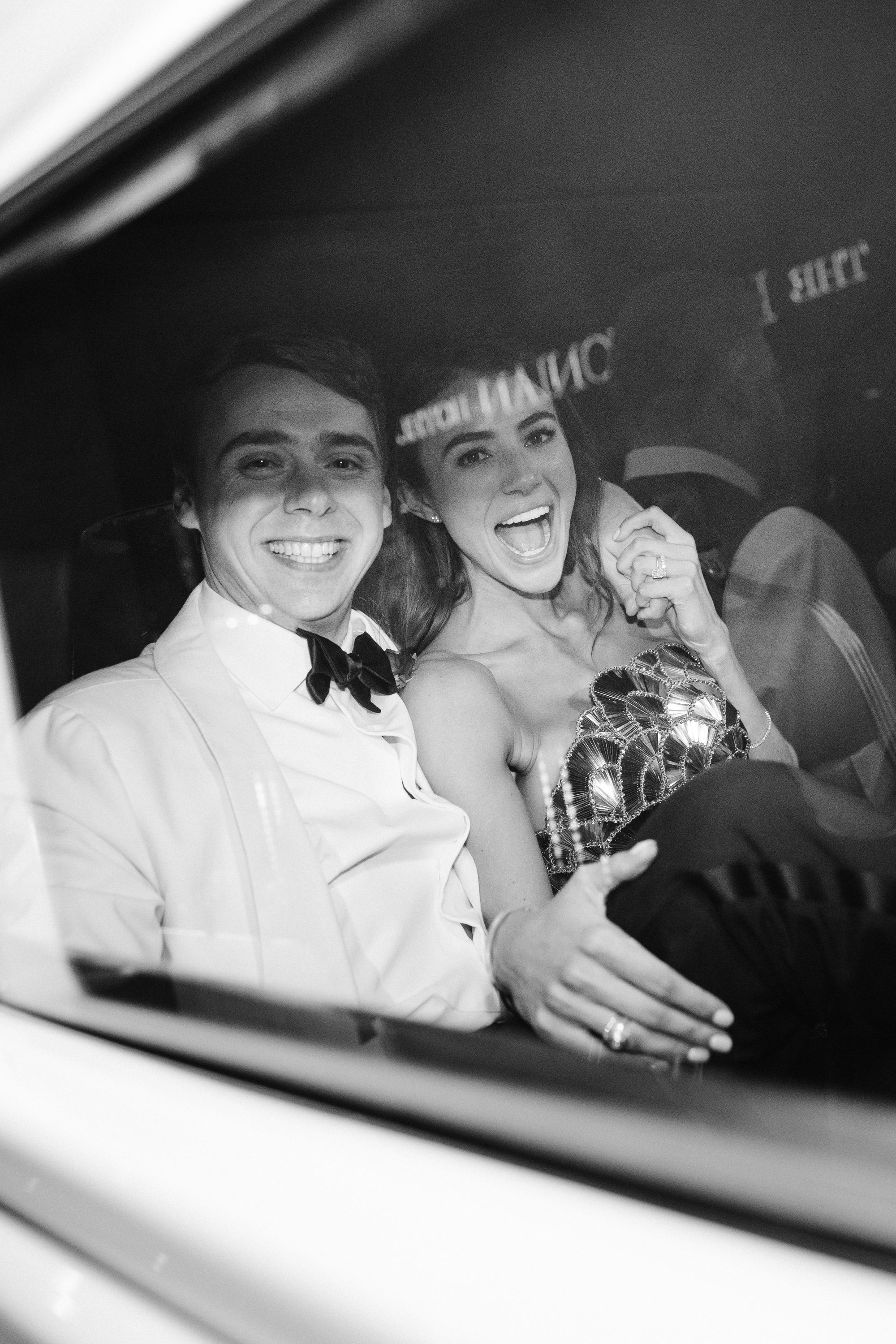 Couple laughing in vintage car at Houstonian Hotel wedding  -  Marco Wang Photography