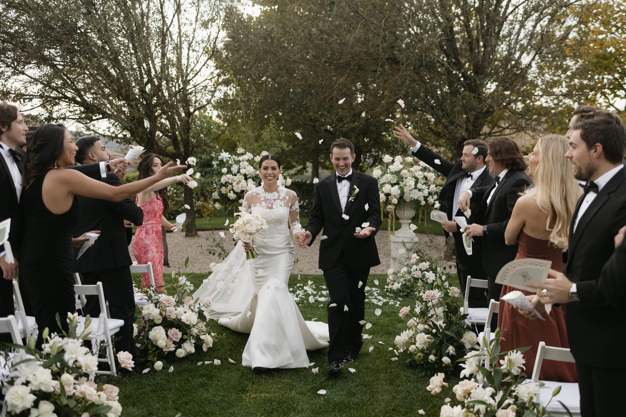 Kaitlin and Ryan petal toss recessional at Ombroneta Villa Tuscany