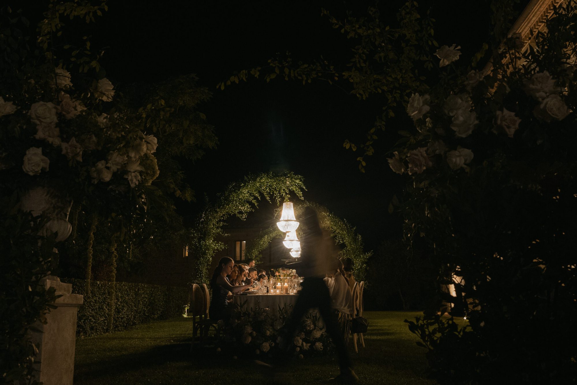 Stone archway lit at night at Ombroneta Villa Tuscany Italy wedding reception