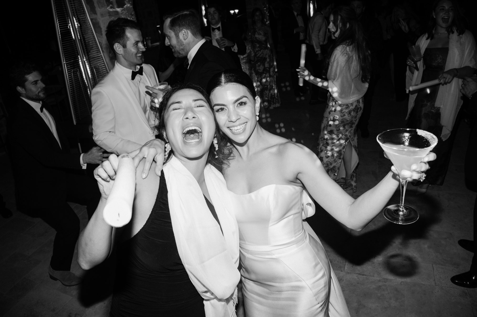 Friends toasting and celebrating at Italian villa after party