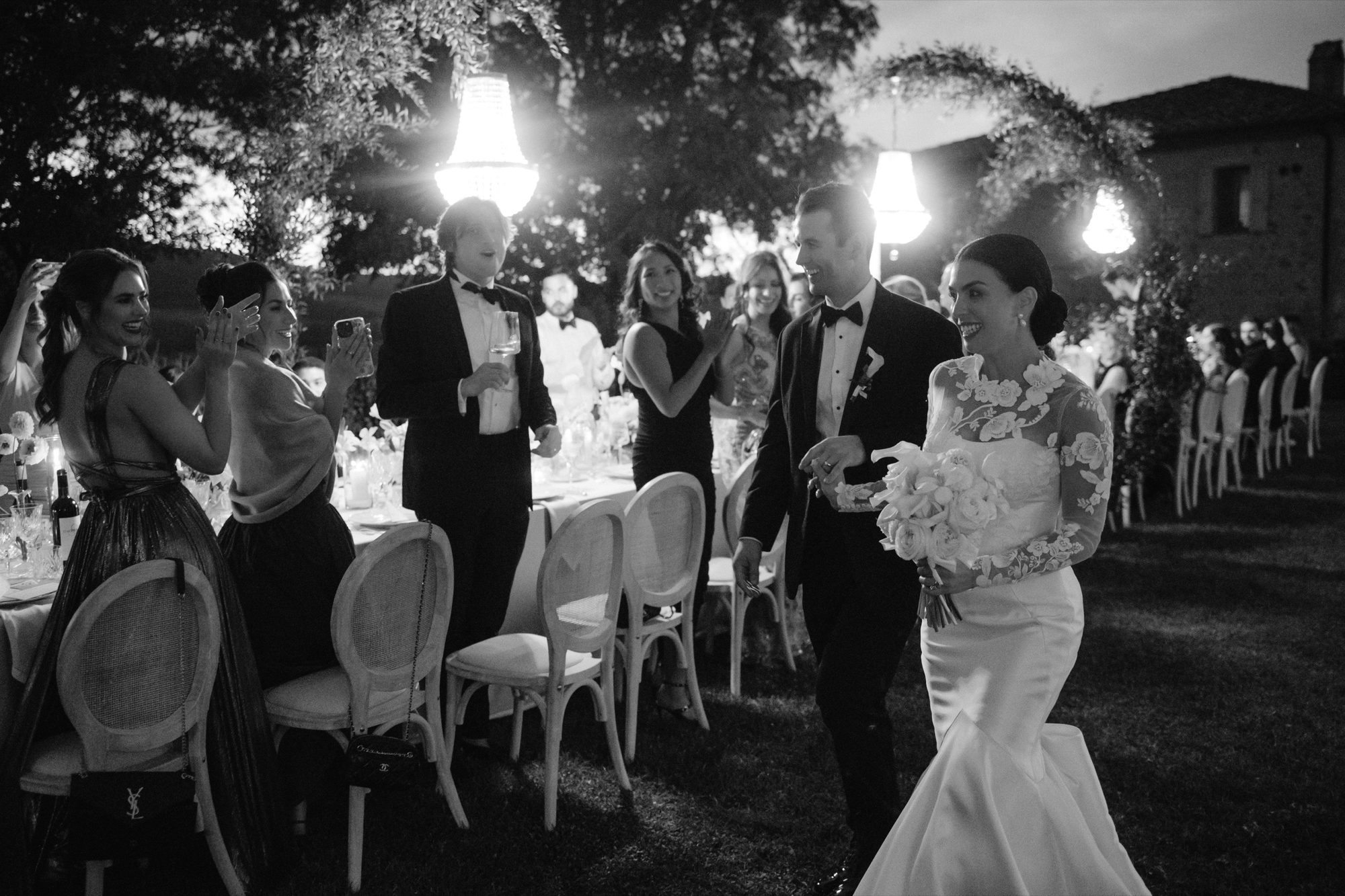 Couple sharing last dance at night under Tuscan stars destination wedding Italy