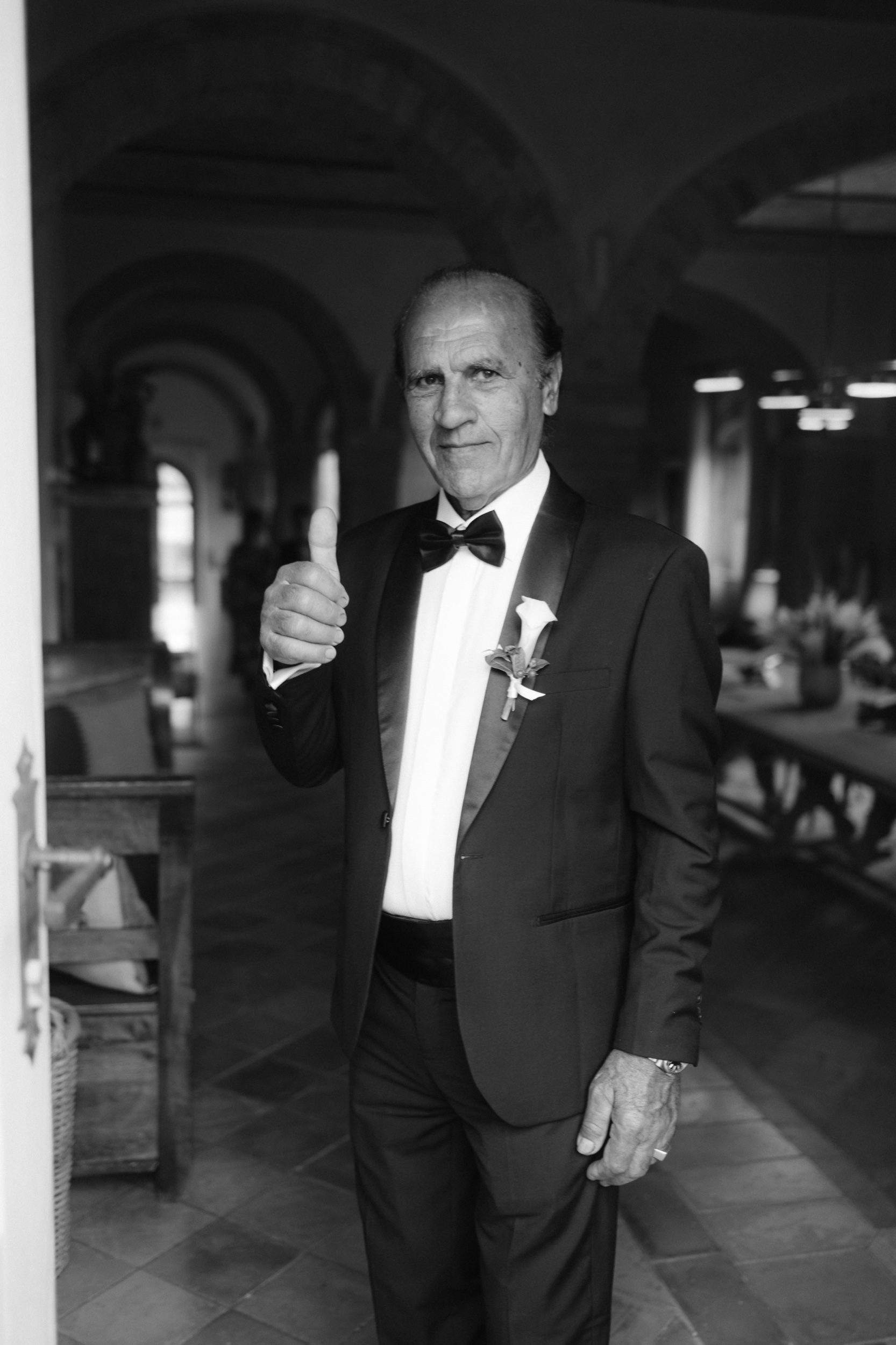 Bride walking to ceremony through Italian garden at Tuscan destination wedding