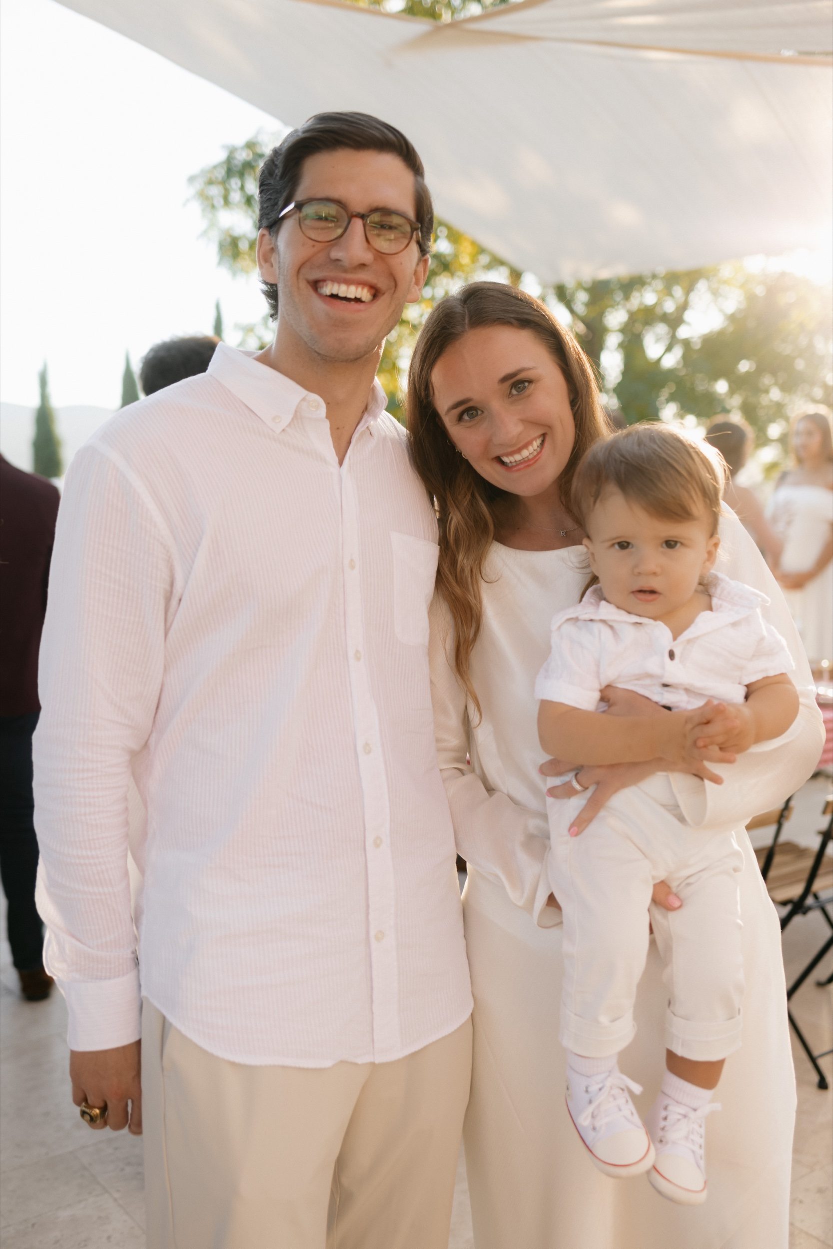 Romantic couple moment among cypress trees at Tuscan destination wedding