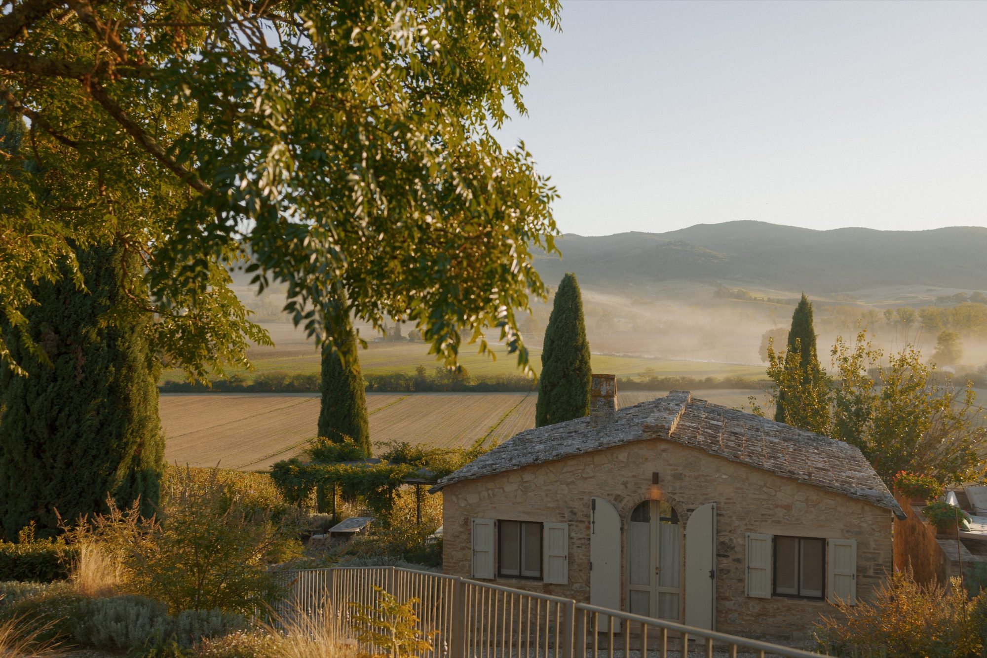 Golden hour poolside farewell gathering at Ombroneta Estate Tuscany destination wedding