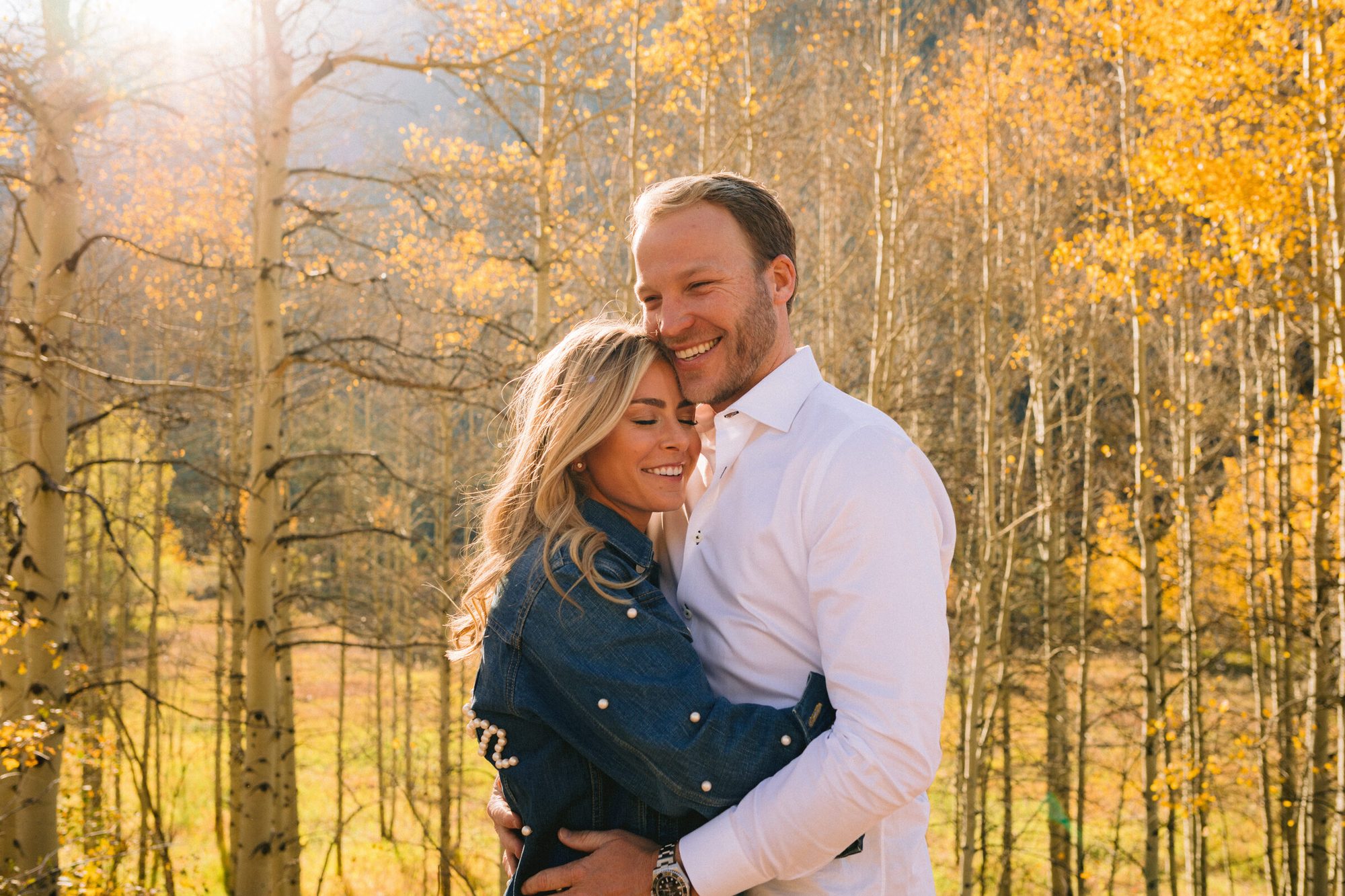 Engagement portrait with golden aspen foliage in Elk Mountains Aspen Colorado
