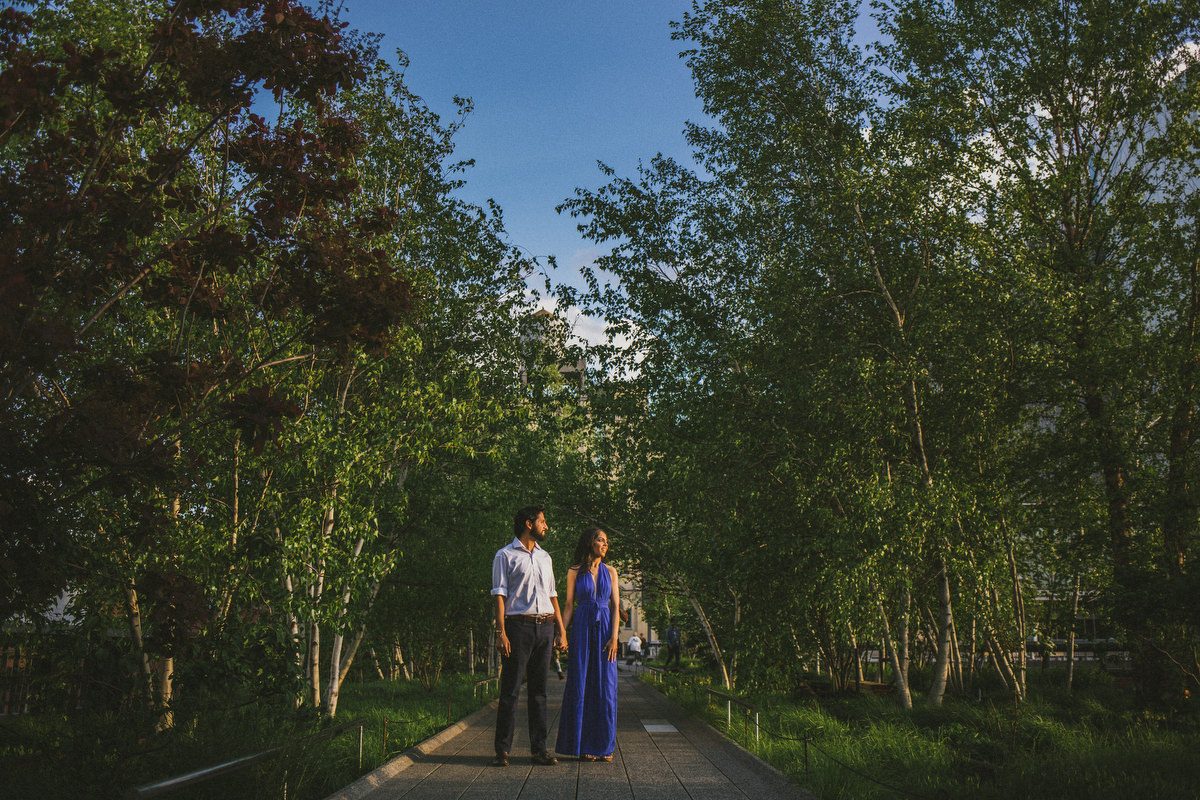 Kavita and Amit in warm golden hour sunlight on the streets of Manhattan during their NYC engagement session by Marco Wang Photography
