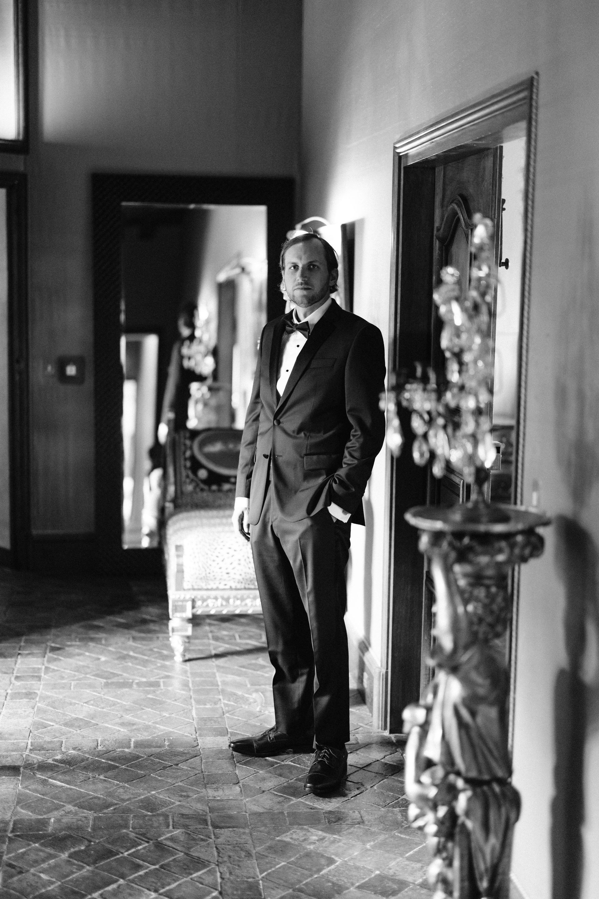 Bride and bridesmaids along castle wall at Chateau de Farcheville France