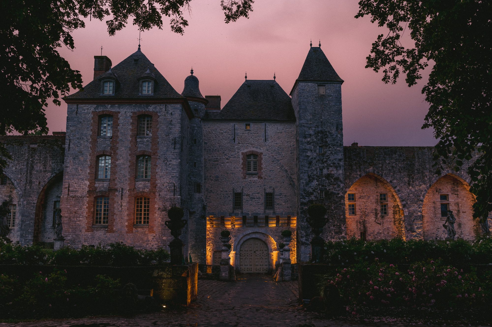 Chateau de Farcheville exterior at twilight France destination wedding