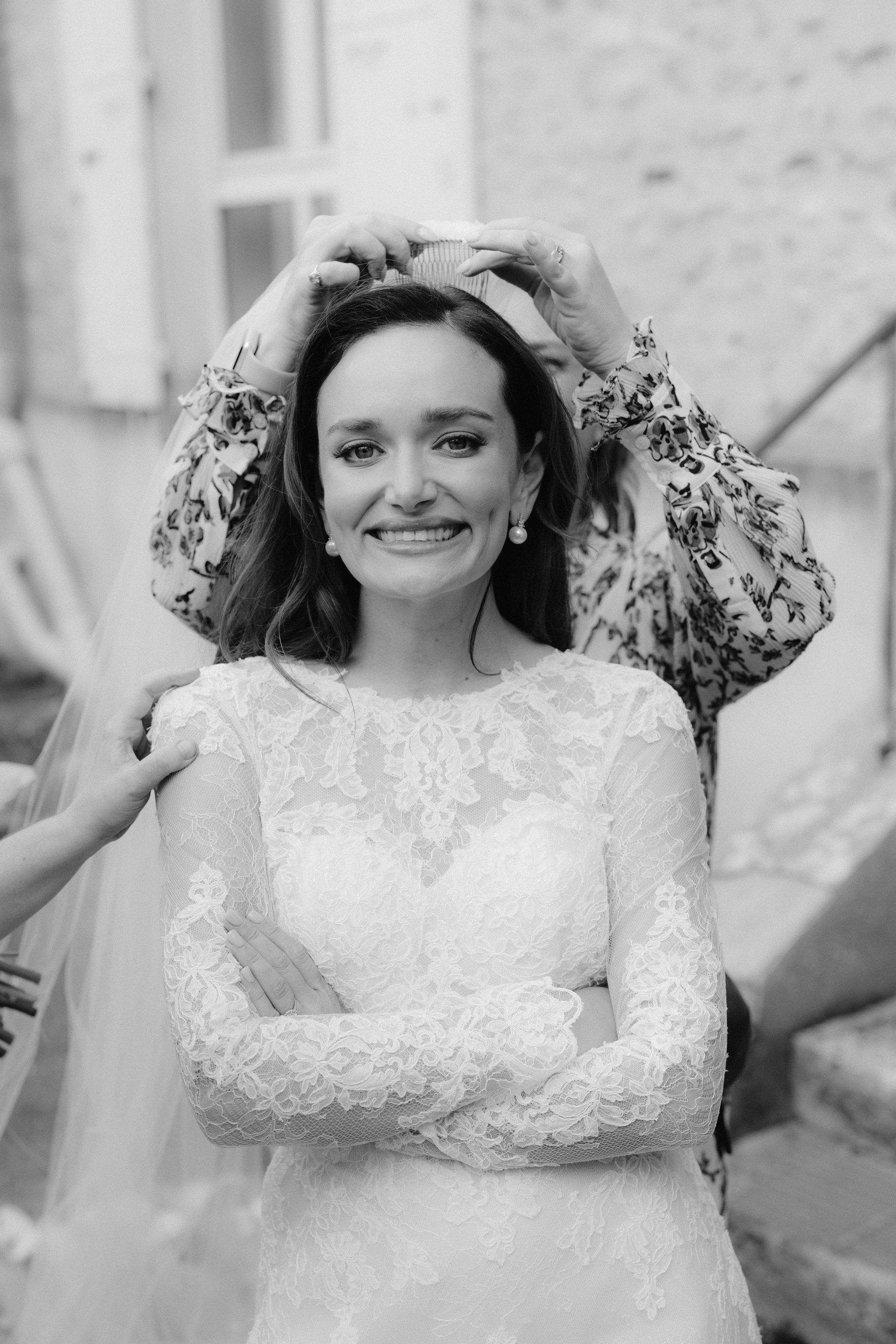 Groom portrait in stone hallway at Chateau de Farcheville France